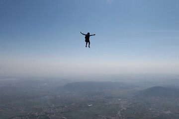 Freefly skydiving. Solo skydiver is having fun in the sky.
