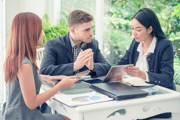 Creative design office center working teamwork. Happy business people partner plan strategy organization research people together at diversity office using laptop, smartphone company conference room