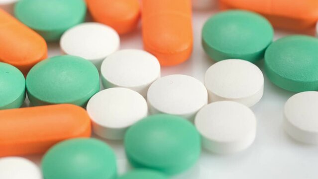 colorful pills - Opioid and prescription medication addiction epidemic or crisis - concept