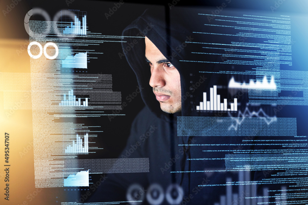 Poster Sifting through the data. Shot of a young hacker cracking a computer code in the dark.