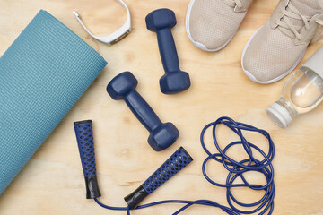 Did you workout today. Studio shot of a variety of workout equipment on a wooden floor.