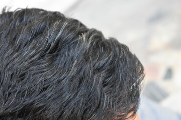 Premature gray hair of an Indian People closeup with blur background