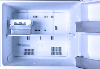 new modern refrigerator opens to reveal the inside. - obrazy, fototapety, plakaty
