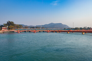 Fototapeta na wymiar isolated iron bridge over ganges river with colorful sky at evening