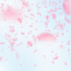 Fototapeta na wymiar Sakura petals falling down. Romantic pink flowers gradient. Flying petals on blue sky square background. Love, romance concept. Worthy wedding invitation.