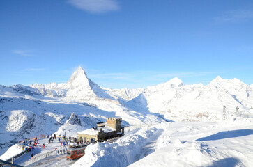 People gather at skiing center on the mountain peak of Matterhorn in Zermatt, Switzerland.