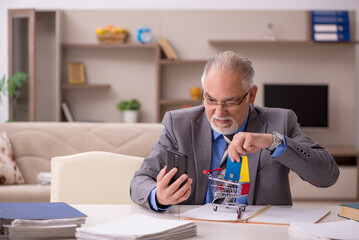 Old male employee in e-commerce concept during pandemic