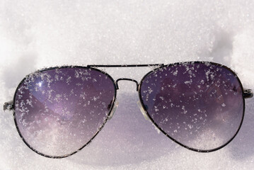 Iced goggles in the cold in the snow.