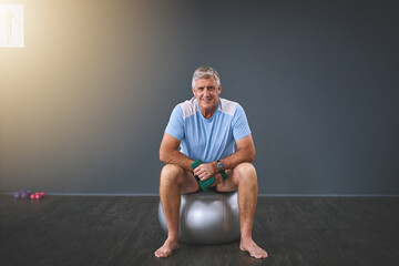 Fototapeta premium Im on the road to recovery. Full length portrait of a handsome senior man doing rehabilitative exercises.
