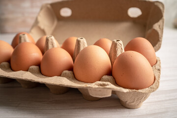Organic fresh eggs in cardboard container pack, organic healthy food.