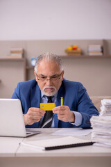 Old male boss working from home during pandemic