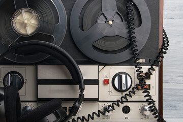 old magnetic turntable and headphones to listen to music