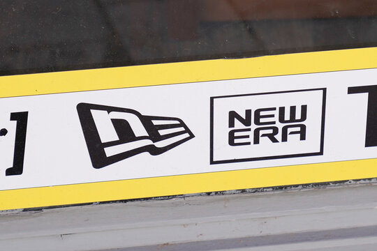 New Era Brand Logo And Text Sign On Windows Shop Front Of Retailer For Newera Cap Brand Store