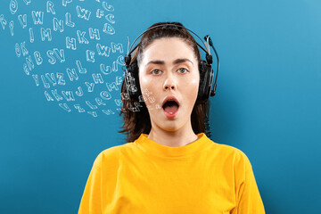World English Language Day. Portrait of a young woman wearing headphones, with her mouth open. Blue...