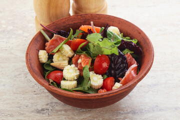 Mix salad with salmon, corn and tomato