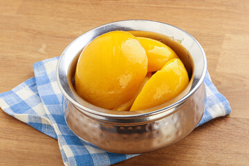Sweet canned peaches with syrope