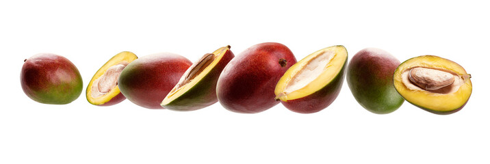 Mango whole and cut levitates on a white background