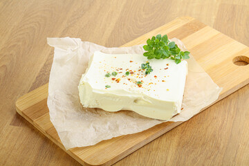 Greek Feta cheese over board