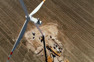 Installing new wind generator, Windmill turbine maintenance, Construction site with cranes for...
