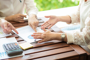 Business man woman hand present business plan with calculator and graph