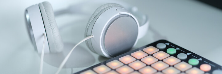 Music production equipment and headphones beatmaker closeup