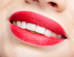 Fototapeta premium Closeup macro portrait of woman smiling red lips with day beauty makeup