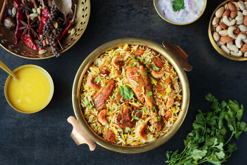 Chicken biryani Spicy Indian Malabar biryani Hyderabadi biryani, Dum Biriyani pulao golden bowl Kerala India Sri Lanka Pakistan basmati rice mixed rice dish with meat curry Ramadan Kareem, Eid