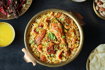 Chicken biryani Spicy Indian Malabar biryani Hyderabadi biryani, Dum Biriyani pulao golden bowl Kerala India Sri Lanka Pakistan basmati rice mixed rice dish with meat curry Ramadan Kareem, Eid