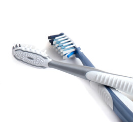  white plastic toothbrush closeup isolated on white.