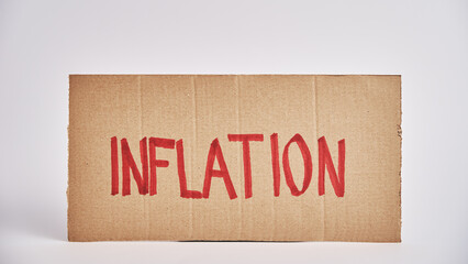 World economic crisis and inflation concept, Paper sheet with word inflation, Rising prices for consumer goods and services