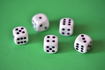 five dice on green