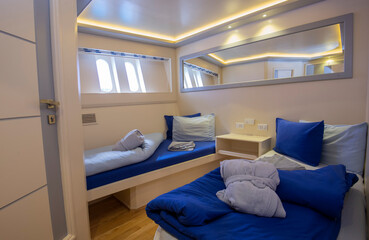Interior of twin cabin on luxury yacht