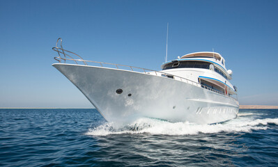 Luxury private motor yacht sailing at sea - obrazy, fototapety, plakaty