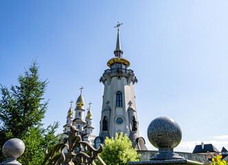 Christian church cross in high steeple tower for prayer