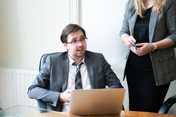Fototapeta premium Young entrepreneur business man presents a business idea to colleagues