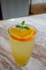 Honey lemon drink on the cafe table background