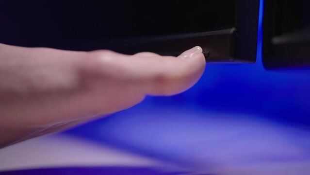 Person foot turn on the computer monitor with big toe toenail close-up 4K