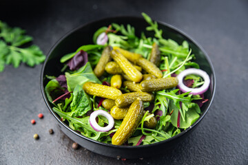salad gherkins pickled cucumbers salty green leaves mix fresh portion meal food diet snack on the table copy space food background rustic top view veggie vegan or vegetarian