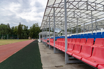 Empty chairs at the football stadium.