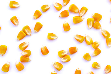 Heap of raw corns seeds, maize or sweetcorn kernels top view isolated on white.