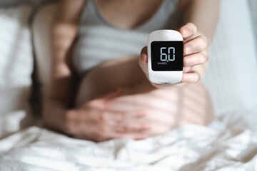 Gestational diabetes in pregnancy. Pregnant woman check sugar level with a glucometer. Glucose intolerance, diabetic fetopathy, hypoglycemia, insulin resistance concept
