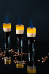 B-52 cocktail flambe (flamed) - layered shot composed of coffee liqueur, Irish cream and orange...
