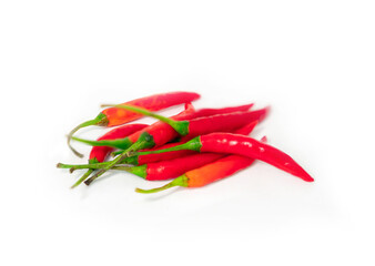 A pile of red chilli peppers isolated on a white background.