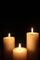 Fototapeta na wymiar three burning candles