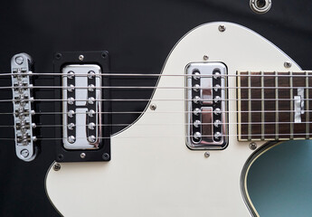 Obraz na płótnie Canvas detail photo of an black electric guitar