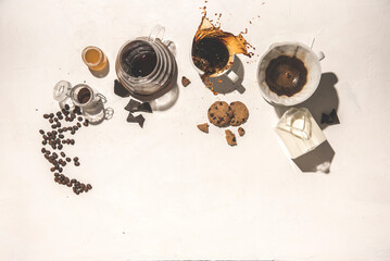 coffee splashed on a breakfast with cookies and honey on a textured white background