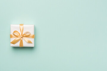 White gift box on color background, top view