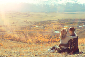 couple hugging in mountains landscape, romance happiness adventure together active