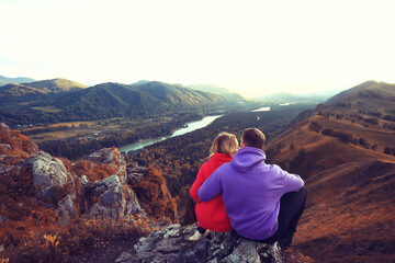 Fototapeta premium couple hugging in mountains landscape, romance happiness adventure together active