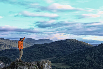 mountain man raised his hands, concept freedom victory active adventure